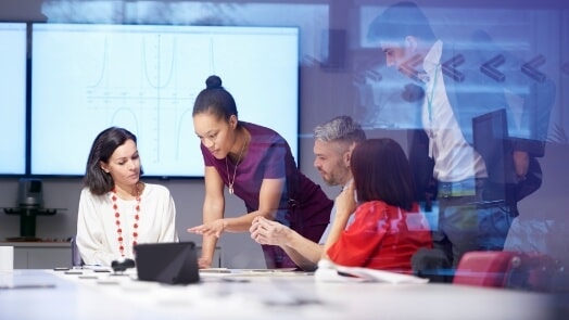A group of IT professionals collaborating